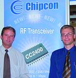 Kevin Jurrius (left) of Components & System Design, and Svein Vetti  of Chipcon, display the CC2400 device at ADEC 2003